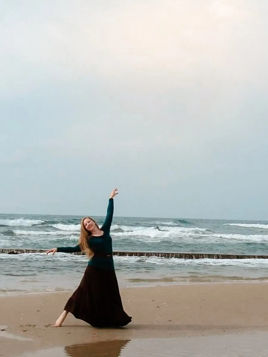 Christen dancing on the beach