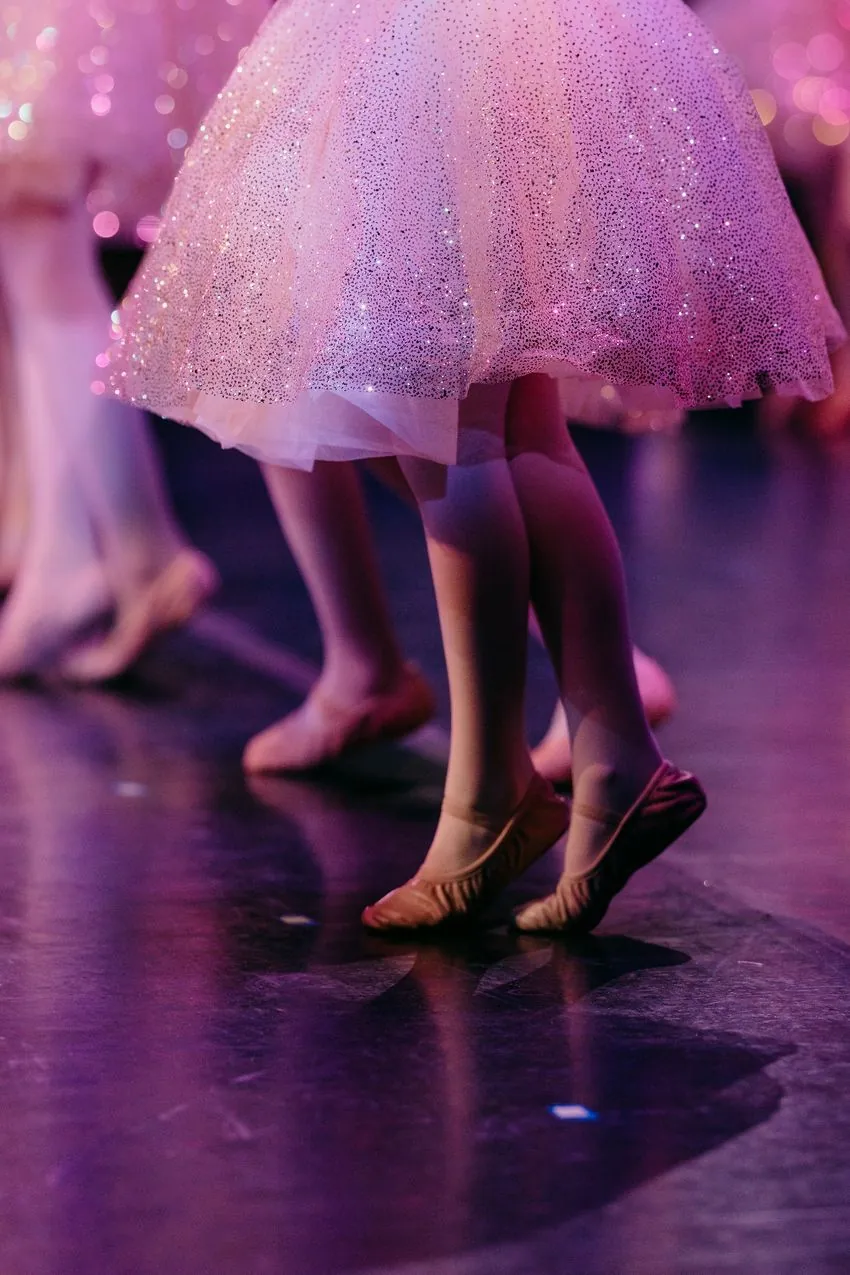 Recital costumes and ballet slippers on stage